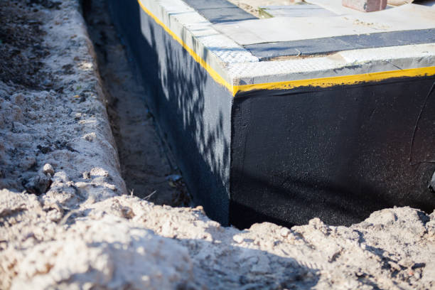 Professional Basement Waterproofing technician working in Arlington, WA